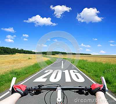 forward-to-new-year-cyclist-riding-bike-51733085.jpg
