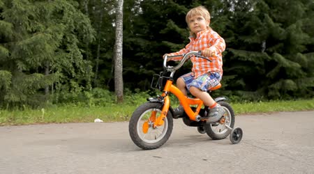 depositphotos_76862615-stock-video-cute-little-child-ride-his.jpg